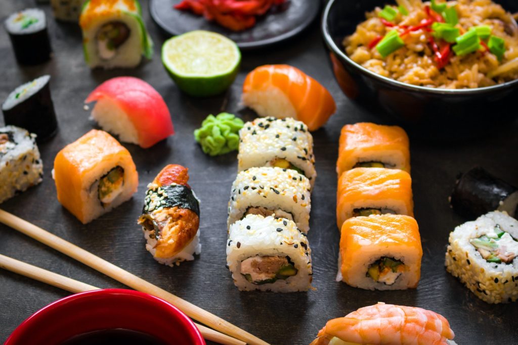 Table served with sushi and traditional japanese food